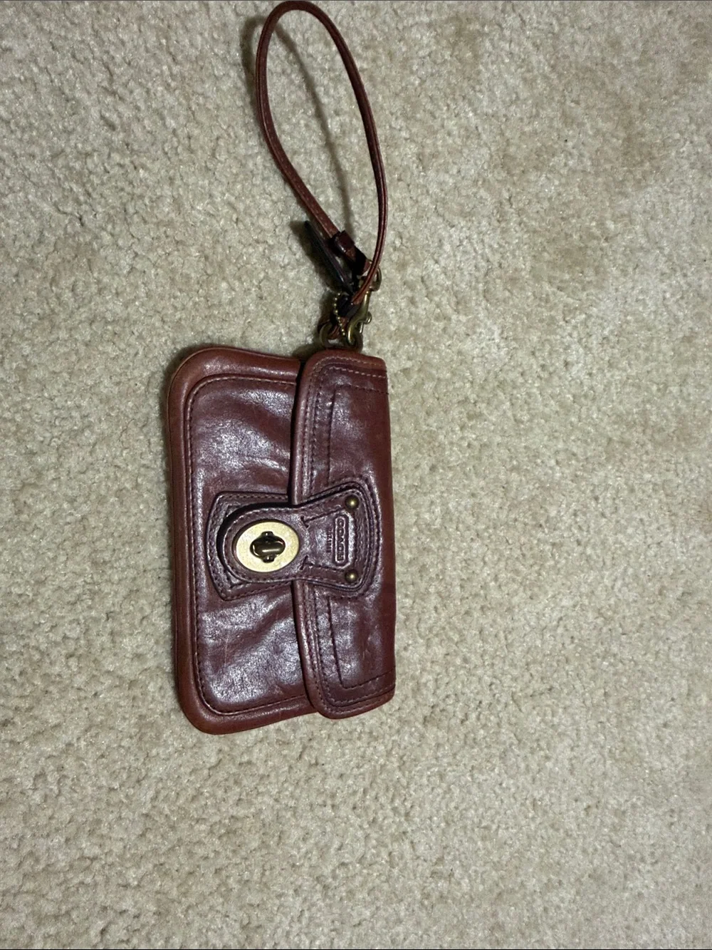 Coach Leather Turn-Lock Wristlet Phone Case in Brown